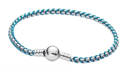 The popular silver wristband features dual tone and woven Cuban ropes, making it fashionable and versatile.